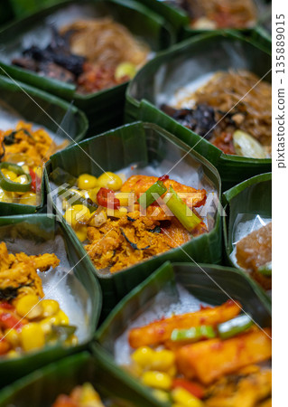 Indonesian Rice Meals Wrapped in Banana Leaf Indonesian Rice Meals Wrapped in Banana Leaf 135889015