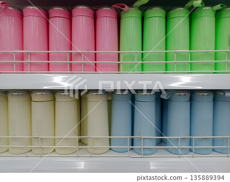 Colorful Pastel Vacuum Insulated Tumblers and Water Bottles on Retail Store Shelf Display Colorful Pastel Vacuum Insulated Tumblers and Water Bottles on Retail Store Shelf Display 135889394