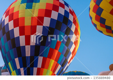 colorful hot air balloons glowing against sky colorful hot air balloons glowing against sky 135889480