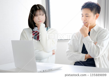 Two students thinking Two students thinking 135889899