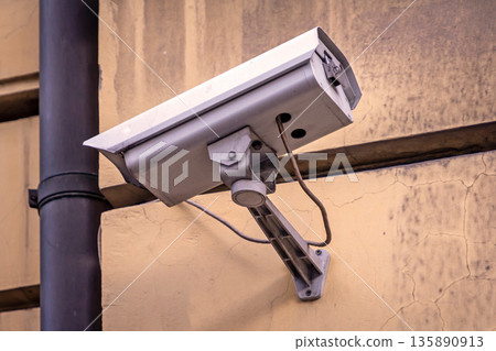 CCTV video surveillance cam on street 135890913