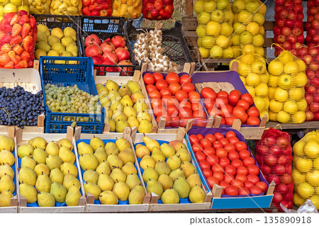 Organic fruits in market stall Organic fruits in market stall 135890918