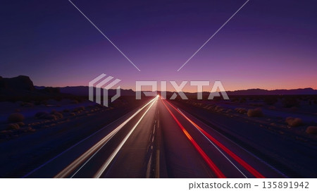 Red and white light streaks following the desert road into the horizon 135891942