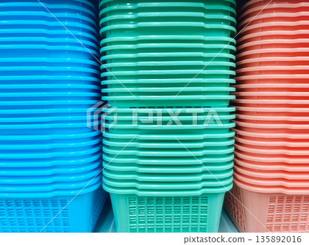 Colorful Plastic Storage Baskets Stacked Vertically for Home and Office Organizing Colorful Plastic Storage Baskets Stacked Vertically for Home and Office Organizing 135892016