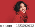 AI-generated photo: A smiling young woman wearing a sweater against a red background 135892032