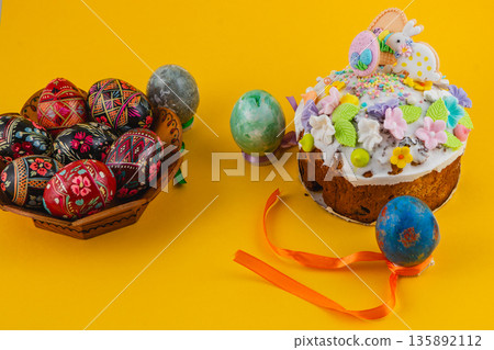 Celebration with decorated eggs and cake at Easter time Celebration with decorated eggs and cake at Easter time 135892112