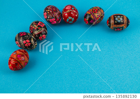 Colorful eggs displayed on a blue background for a festive occasion 135892130