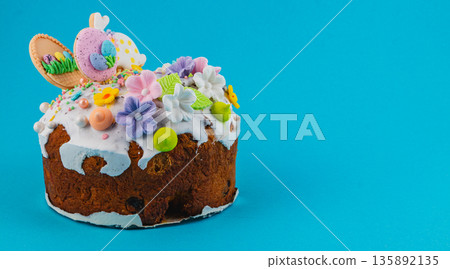 Easter cake with colorful decoration on blue background Easter cake with colorful decoration on blue background 135892135