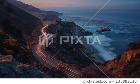 A winding mountain road with mesmerizing light trails leading to an isolated beach surrounded by towering cliffs A winding mountain road with mesmerizing light trails leading to an isolated beach surrounded by towering cliffs 135892136