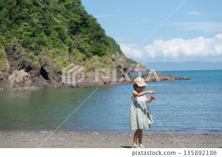 Children playing at the beach Children playing at the beach 135892186