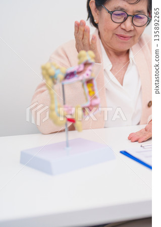 Elderly woman Patient consultation with doctor for Colon disease, Large Intestine, Colorectal cancer, Ulcerative colitis, Diverticulitis, Irritable bowel syndrome, Digestive system and Healthcare Elderly woman Patient consultation with doctor for Colon disease, Large Intestine, Colorectal cancer, Ulcerative colitis, Diverticulitis, Irritable bowel syndrome, Digestive system and Healthcare 135892265