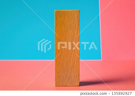Simple wooden block stands against colorful background in minimalistic design 135892927