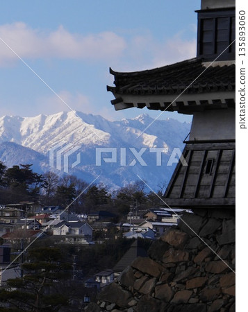 The castle tower of Matsumoto Castle, a national treasure, stands against the backdrop of the Northern Alps in winter. January 29, 2015, Matsumoto City, Nagano Prefecture, Japan The castle tower of Matsumoto Castle, a national treasure, stands against the backdrop of the Northern Alps in winter. January 29, 2015, Matsumoto City, Nagano Prefecture, Japan 135893060