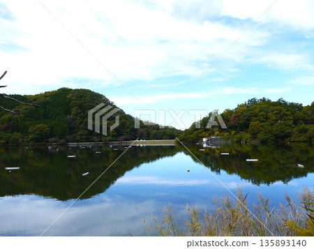 Sky and mountains reflected in Lake Chiyoda 135893140