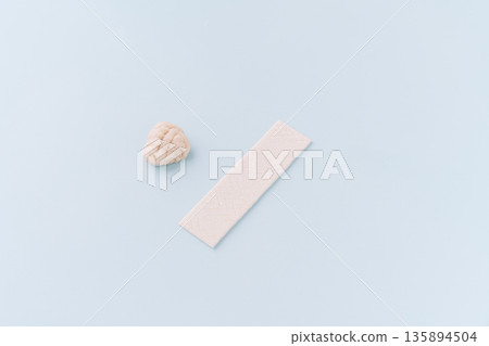 Chewing gum stick and chewed gum on blue background, comparison concept Chewing gum stick and chewed gum on blue background, comparison concept 135894504