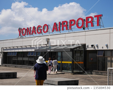 The red logo and observation deck of Yonago Airport stand out against the blue sky. September 6, 2014, Sakaiminato, Japan 135894530
