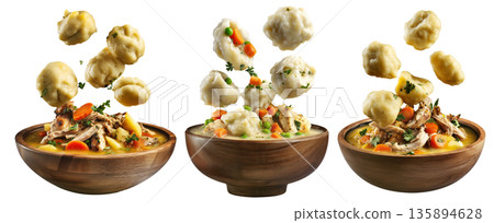 Hearty chicken and dumplings soup with peas and carrots in wooden bowl, floating dumplings, isolated on white background Hearty chicken and dumplings soup with peas and carrots in wooden bowl, floating dumplings, isolated on white background 135894628