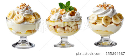 Banana pudding dessert with whipped cream and mint leaves in glass cup, isolated on white background, concept of sweet treat 135894687