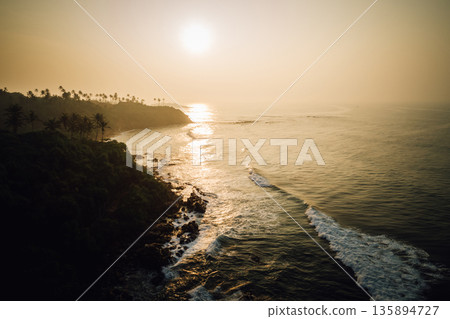Aerial view of beautiful sunrise on the seaside in Sri lanka Aerial view of beautiful sunrise on the seaside in Sri lanka 135894727
