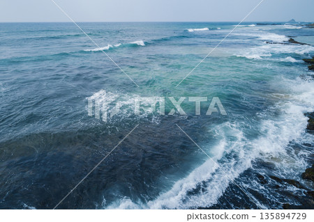 Aerial view of beautiful waves broken on the seaside in Sri lanka Aerial view of beautiful waves broken on the seaside in Sri lanka 135894729