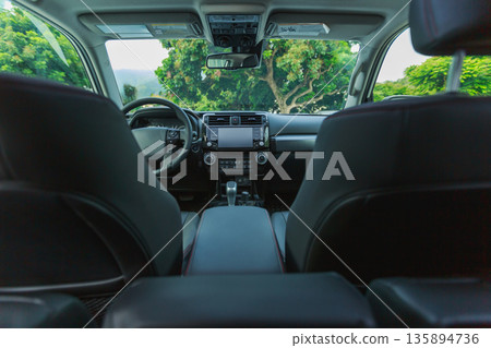 Interior of new off road car in forest mountains Interior of new off road car in forest mountains 135894736