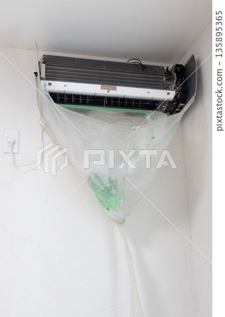 After removing and protecting parts during air conditioner cleaning After removing and protecting parts during air conditioner cleaning 135895365