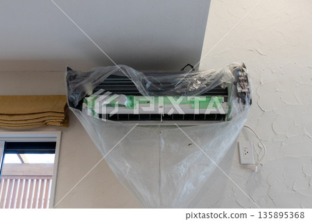After removing and protecting parts during air conditioner cleaning After removing and protecting parts during air conditioner cleaning 135895368