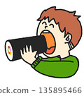 Boy eating ehomaki 135895466