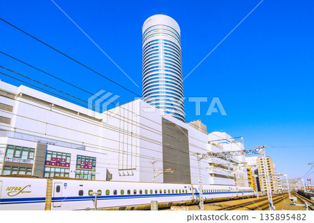 A new era for the urban landscape of Yokohama, Japan. Inbound tourism continues... Looking out at the Shinkansen and Yokohama Prince Hotel. Towards a future of rapid progress. A new era for the urban landscape of Yokohama, Japan. Inbound tourism continues... Looking out at the Shinkansen and Yokohama Prince Hotel. Towards a future of rapid progress. 135895482