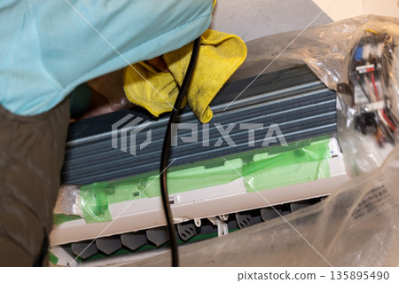 After removing and protecting parts during air conditioner cleaning 135895490