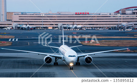 A large JAL aircraft running head-on at Haneda Airport A large JAL aircraft running head-on at Haneda Airport 135895812