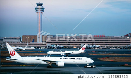 Haneda Airport control tower and JAL Boeing 777 135895813