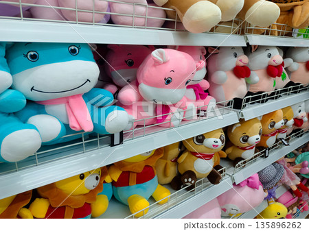 Cute Colorful Animal Plush Toys on Store Shelf for Children 135896262