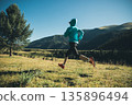 Fitness asian woman runner running at sunrise grassland 135896494