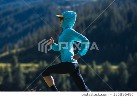Fitness asian woman runner running at sunrise grassland 135896495