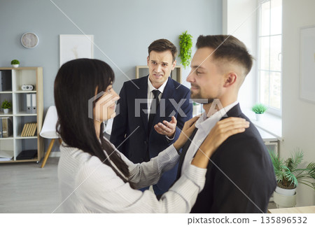 Confrontation over cheating: woman chooses one man as rival reacts in office 135896532