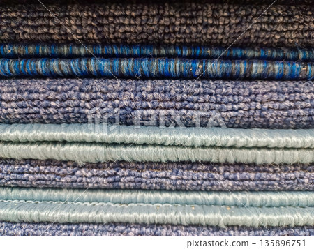 Stack of Blue and Light Blue Carpet Samples Texture for Interior Design 135896751