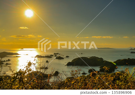 Sasebo City, Nagasaki Prefecture - View of the Kujukushima Islands at sunset from Ishidake Observatory, the filming location for The Last Samurai Sasebo City, Nagasaki Prefecture - View of the Kujukushima Islands at sunset from Ishidake Observatory, the filming location for The Last Samurai 135896906