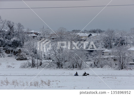 Snow-covered Satoyama residential area and motorcycle commuting: Living in rural areas in winter Snow-covered Satoyama residential area and motorcycle commuting: Living in rural areas in winter 135896952