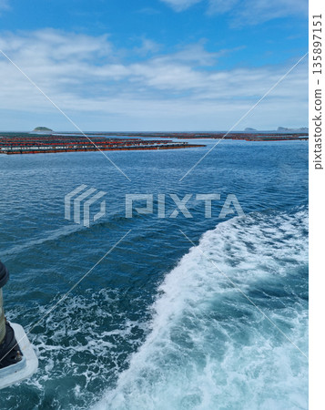 It is a blue sea and a ship trace. It is a blue sea and a ship trace. 135897151
