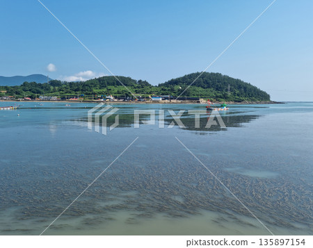 It is a seascape of an island village. It is a seascape of an island village. 135897154