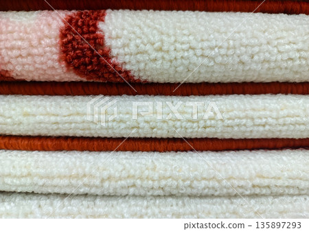 Stack of White and Red Patterned Rugs for Home Interior Decor 135897293