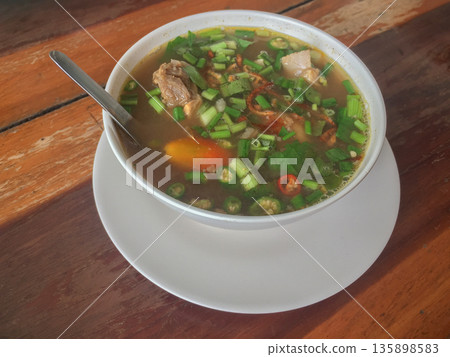 Goat stew soup with vegetable 135898583