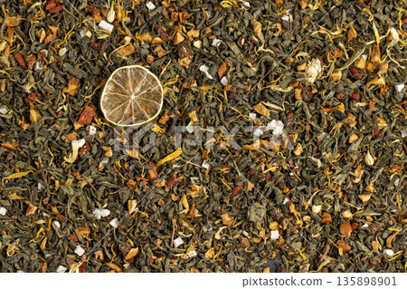 natural green tea with added flavors and pieces of fruit and cut dried green limes , bright large dry lime slices and green tea with pieces of fruit natural green tea with added flavors and pieces of fruit and cut dried green limes , bright large dry lime slices and green tea with pieces of fruit 135898901