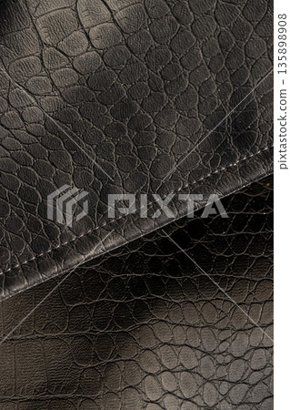 artificial fabric in the style of crocodile skin with specks and spots, a piece of clothing made in the style of leather items made of artificial leather artificial fabric in the style of crocodile skin with specks and spots, a piece of clothing made in the style of leather items made of artificial leather 135898908