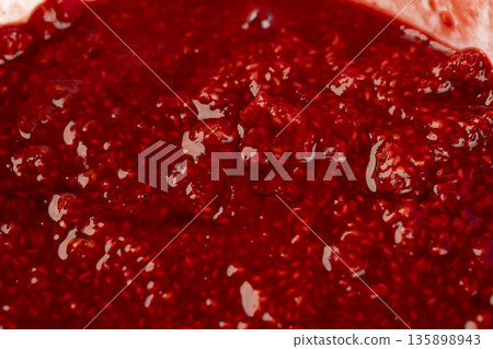 juicy red fresh grated strawberries , making a sweet, delicious and juicy dessert from natural berries, a large bowl with grated ripe strawberries while making jam or desserts juicy red fresh grated strawberries , making a sweet, delicious and juicy dessert from natural berries, a large bowl with grated ripe strawberries while making jam or desserts 135898943