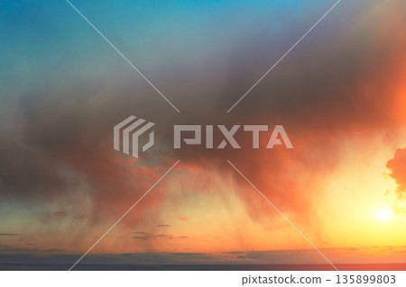Dramatic colorful evening cloudy sky during sunset Dramatic colorful evening cloudy sky during sunset 135899803