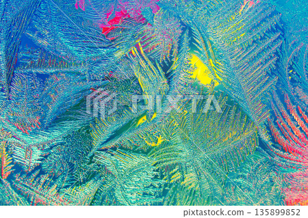 Photo of natural colorful ice texture with light on the frozen glass. Abstract background Photo of natural colorful ice texture with light on the frozen glass. Abstract background 135899852