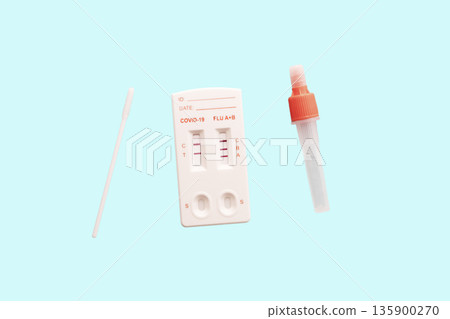 Hand holds a Rapid Antigen Test kit with Negative result during swab COVID-19 testing. Hand holds a Rapid Antigen Test kit with Negative result during swab COVID-19 testing. 135900270
