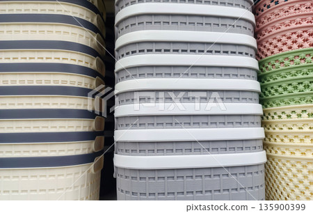 Stack of Plastic Storage Baskets with Woven Texture for Home Organization and Laundry Stack of Plastic Storage Baskets with Woven Texture for Home Organization and Laundry 135900399